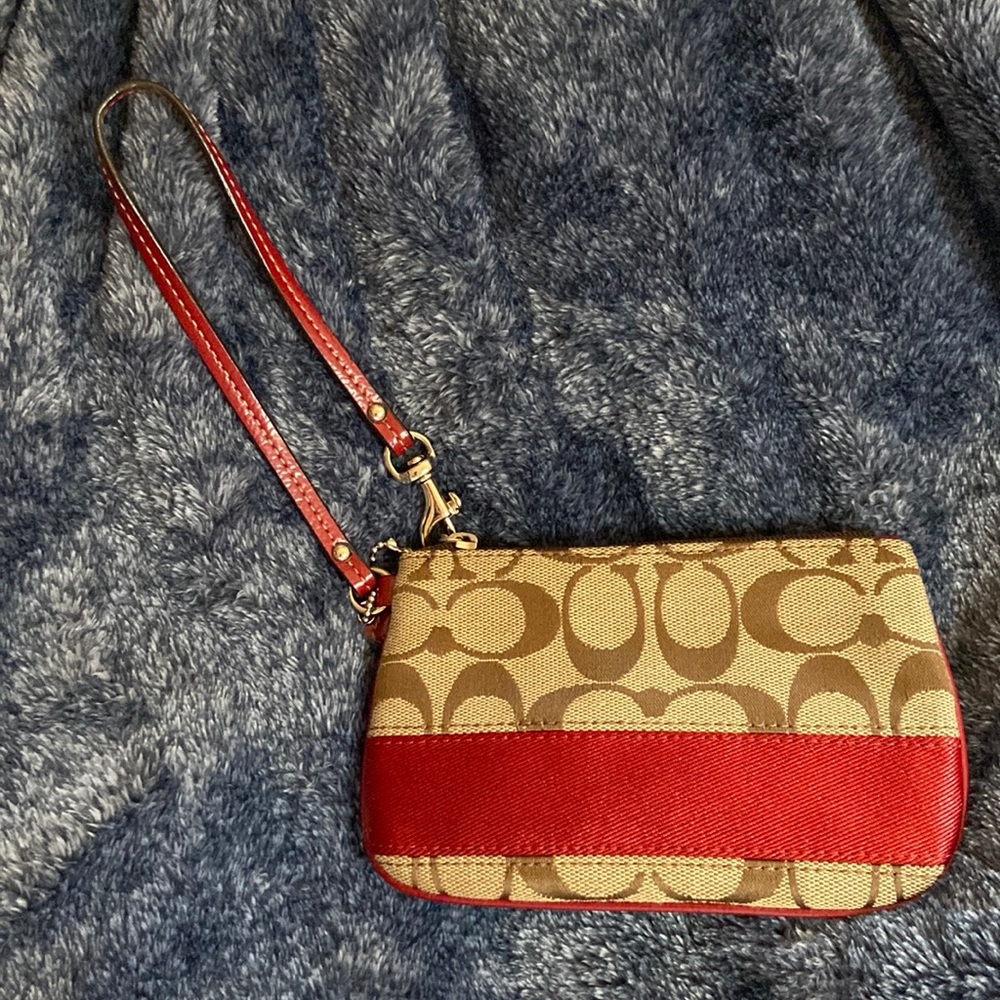 Red and tan/brown Coach brand coin purse
